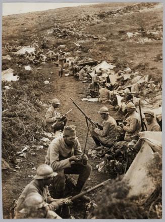 With the Serbians on the Balkan front. No 766 Serbians in reserve clean their rifles and sharpen their bayonets