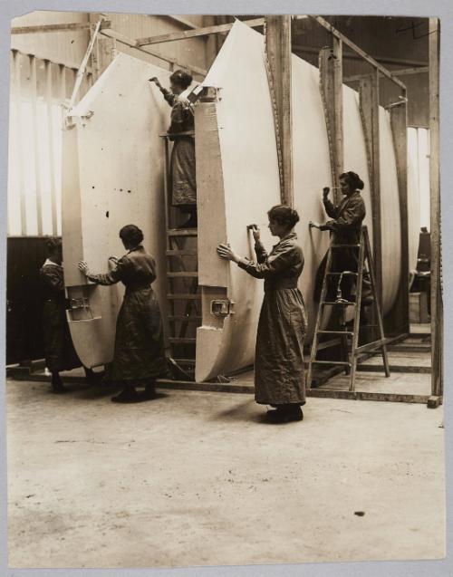 Aeroplane framing and building is now being taught at Ferndale-road School, Brixton. Women testing the various joints and screws for the aeroplane