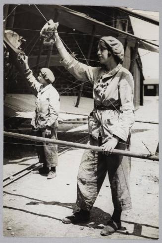 [Women working on an aeroplane]