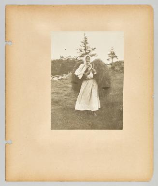 [A woman carries bushels of branches for firewood on her back]. Page 48 of Newfoundland from Collection of Canadian albums compiled by Edith S. Watson
