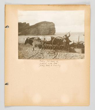 Gathering fish heads for fertilizer, on the North fishing beach, in Percé, P.Q. Page 31 of Fish; from collection of Canadian albums compiled by Edith S. Watson, 1890s-1930s
