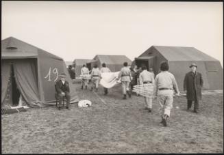 A refugee camp is erected and volunteers brings supplies including bed frames and mattresses in the aftermath of an earthquake in Tuscany that left about 5,000 homeless