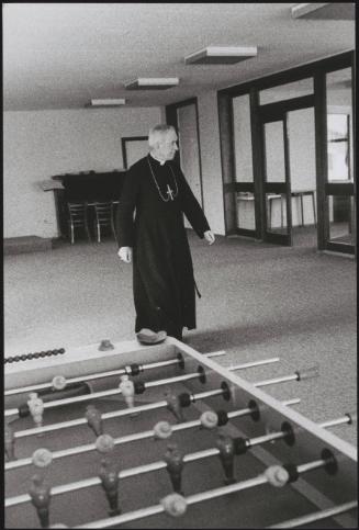 Monsignor Marcel Lefebvre walks in a room of his seminary in Econe, Switzerland