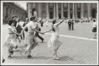 Men and women skipping and dancing in St. Peter's Square