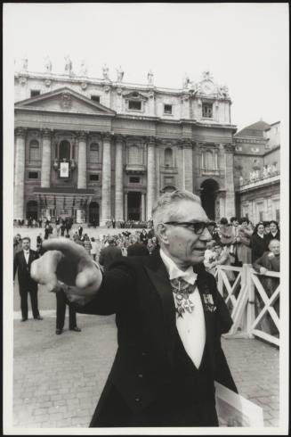 One of the Papal Household directing onlookers at the Apostolic Palace, Vatican City, Rome