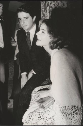 Partners and peers, Christian De Sica and Silvia Verdone at a party