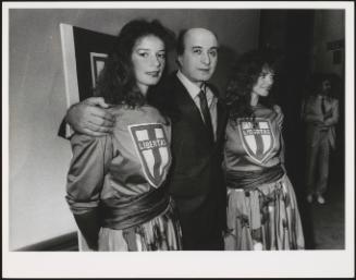 Two women wear Libertas (Christian democracy) T-shirts and stand either side of politician Ciriaco Luigi De Mita