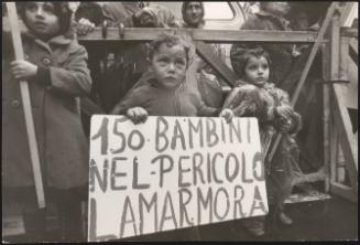 Three young children at a protest for housing