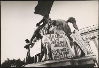 Five demonstrators affiliated with the Italian Communist Party stand on the statue of Marcus Aurelius on the Campidoglio in Rome, protesting against high rent and the right to cheaper housing