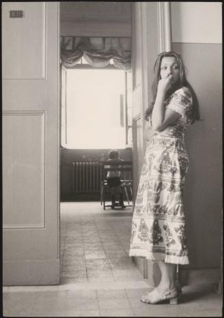 A student waits to walk into the examination room during high school final exams at the Liceo Classico Mamiani, Rome