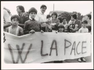Children holding a banner at a peace march