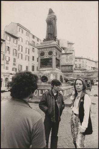 Joanna Harcourt-Smith next to the defaced monument to Giordano Bruno in Piazza Campo de Fiori, Rome