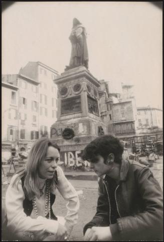 Joanna Harcourt-Smith next to the defaced monument to Giordano Bruno in Piazza Campo de Fiori, Rome