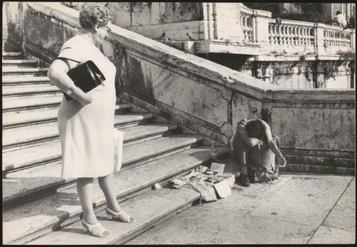A Hippy begging for change on the steps of Trinità dei Monti, Rome