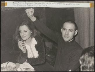 Pierre Clementi celebrates his freedom from prison and the courts in a restaurant in Rome. Pictured with actress Tamara Triffez 