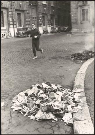 Electoral flyers and posters are swept up and set alight in Piazza Navona, Rome