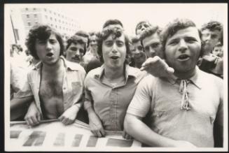 A packed crowd of young men at an unspecified protest 