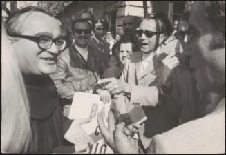 A crowd of divorce supporters have a discussion with a friar in the street, on the day when the Italian Senate votes on the issue of divorce