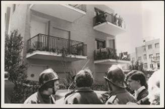 Police investigate magistrate Infelisi while examining the apartment near Via Cassia, a hideout for the Red Brigade group who kidnapped Moro