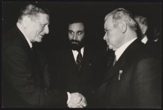 Andrei Kirilenko shakes hands with another gentleman at the PCI congress, March 18th - 23rd 1975, Rome
