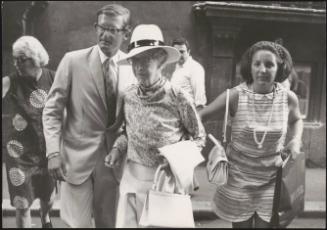 Queen Juliana Wilhelmina of the Netherlands with her husband Prince Bernhard and their daughter Irene out shopping