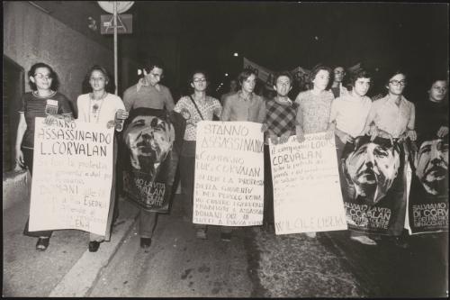 Protesters carrying placards with messages of solidarity with Chile and Luis Corvalan, the general secretary of the Communist Party of Chile