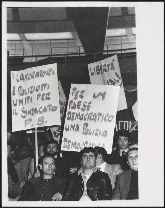 Protesters and Policemen demonstrating in support of the unions