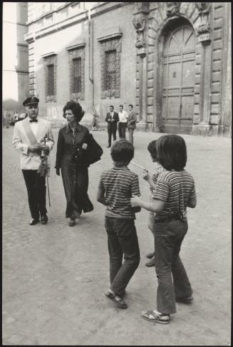 Wedding guests around the Basilica of Santa Maria in Trastevere, Rome