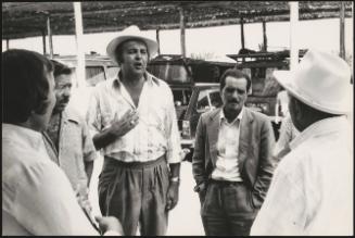 Romani men in a caravan park