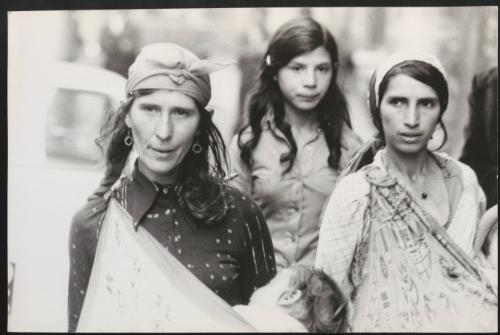 Romani women carrying their children