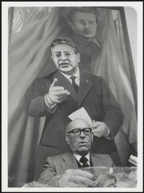 A PCI member speaks at a meeting in the Tor de Schiavi district, Rome