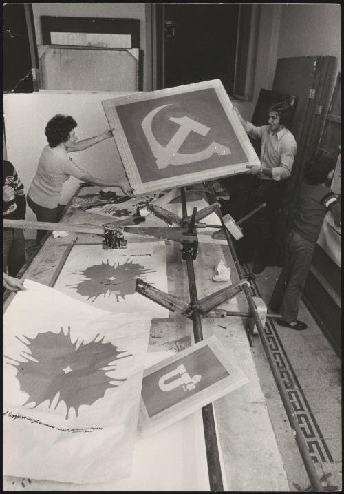 Communist party supporters screen printing posters 