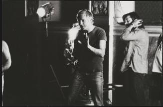 Portrait of Hungarian director Miklós Jancsó at work on set