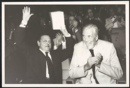 Directors Alessandro Blasetti and John Huston sit next together at an unspecified industry event