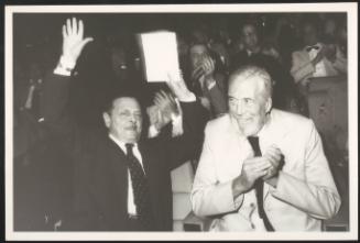Directors Alessandro Blasetti and John Huston sit next together at an unspecified industry event