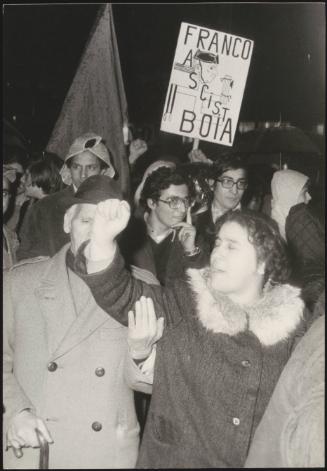 Protesters, including one holding a placard with an anti Franco slogan, at an anti fascist protest