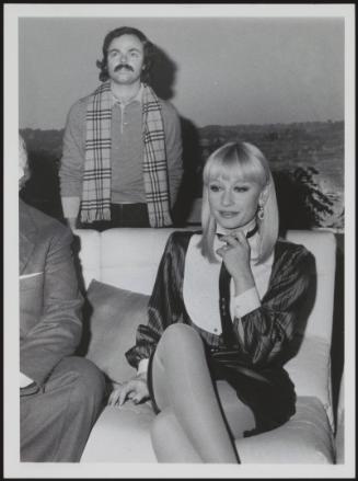 Filmmaker Sergio Japino stands behind his partner Raffaella Carrà