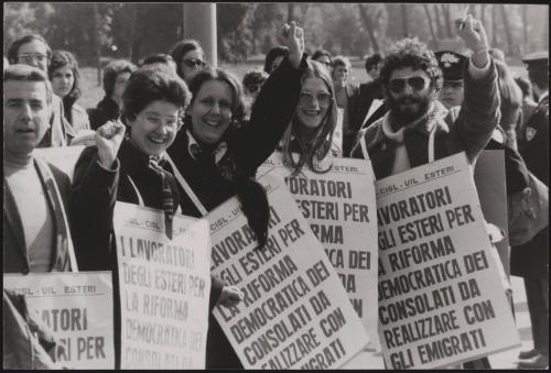 A line of workers from the Ministry of Foreign Affairs wearing placards demanding workers rights for foreign workers 