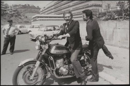 Actor Federico Martignoni with club owner Paolo Vassallo on a motorbike during the Number One night club drugs scandal

