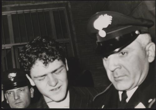 Raphael Minichiello, planejacker, being led away by Carabinieri in court