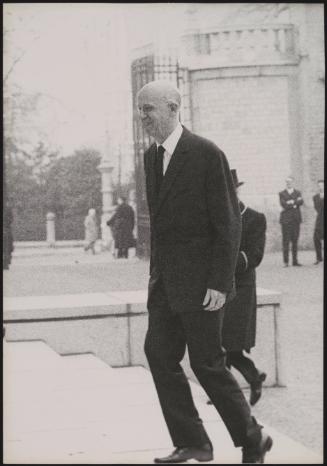A minister arriving to meet British Prime Minister Harold Macmillan