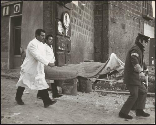 A victim is carried out on a stretcher after an explosion 