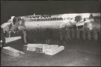 The coffins of the victims in front of the Pan Am aircraft bombed during the massacre at Fiumicino airport, 12.17.1973