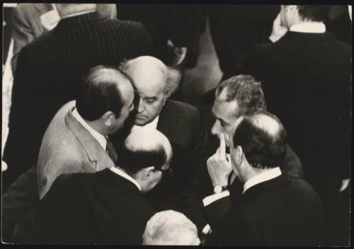 A huddle of politicians including Aldo Moro, Giovanni Galloni and Carlo Donat-Cattin in parliament