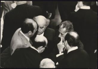 A huddle of politicians including Aldo Moro, Giovanni Galloni and Carlo Donat-Cattin in parliament