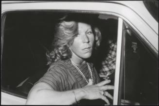 A woman is photographed as she arrives in her car at the funeral of magistrate Vittorio Occorsio after his assassination by the neo-fascists on 10th July 1976