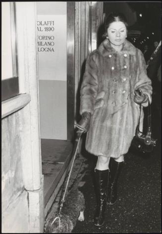 Princess Soraya of Iran walking her dog in the Italian streets