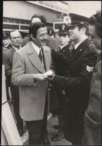 Security check at the entrance of the Court before Pietro Valpreda's trial, a member of the Cavallo jury has his documents checked