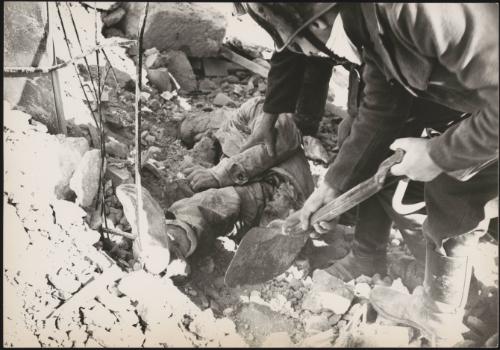 A victim of the Belice earthquake is dug from the rubble by police, 1968, Sicily