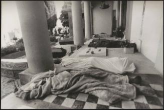Bodies of the victims from the Friuli earthquake in 1976, are lined up outside a building ready to be put into coffins in Osoppo cemetery 
